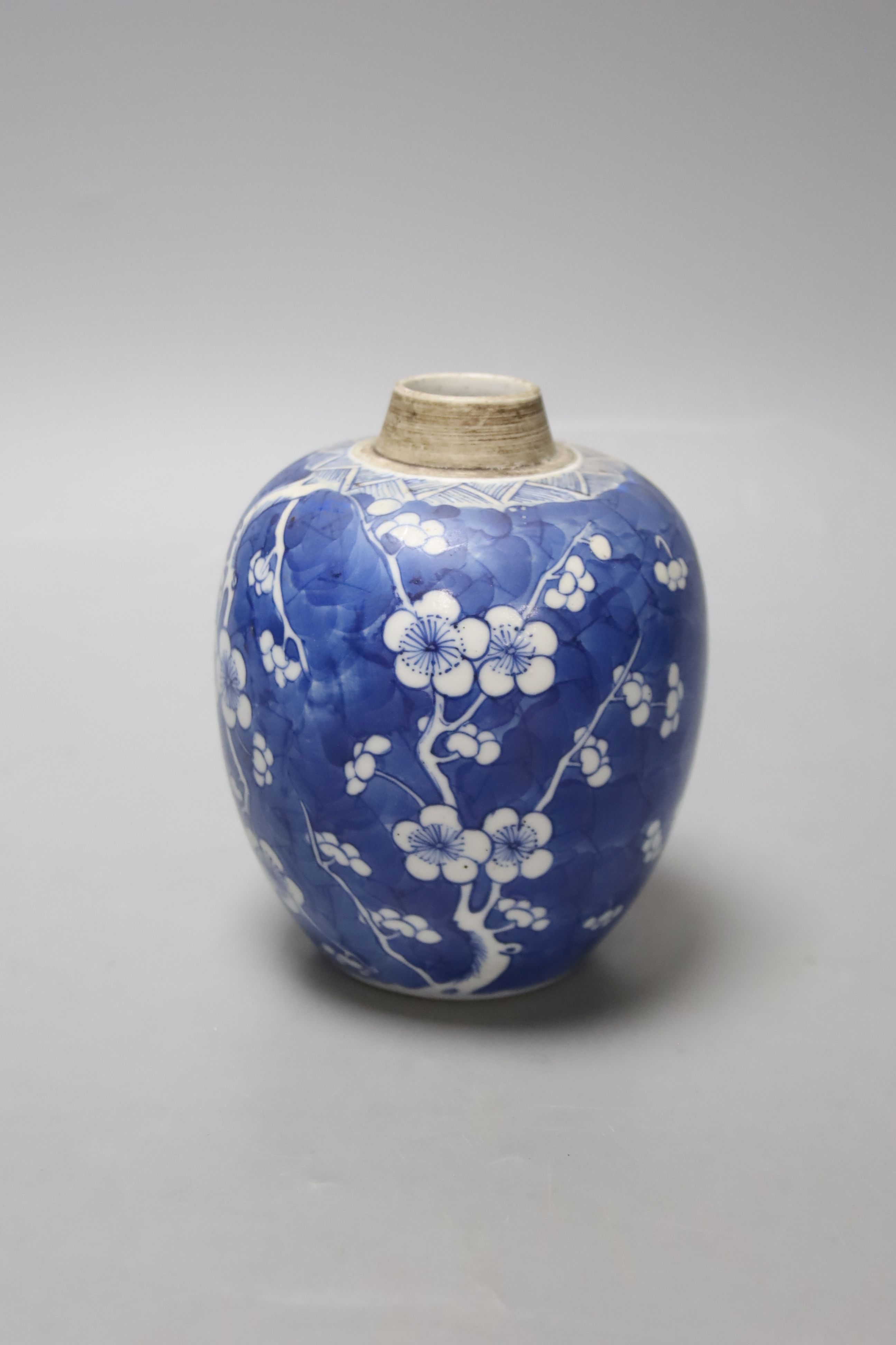 A Chinese Kangxi blue and white prunus jar, lacking cover, height 12cm